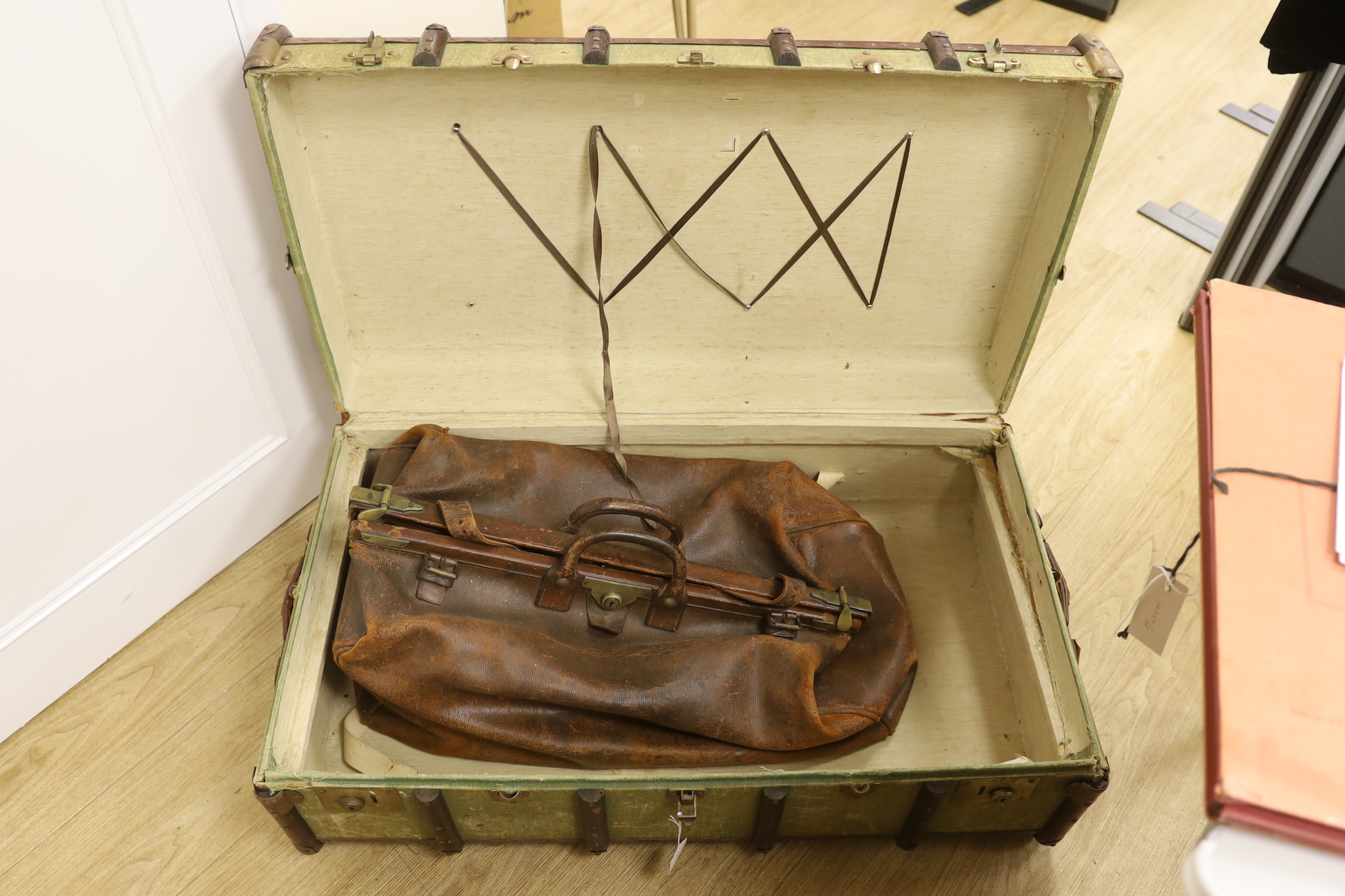 A steamer trunk and a leather Gladstone bag, trunk 63cm wide